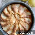 Pear cake baked in a round pan and ready to serve.