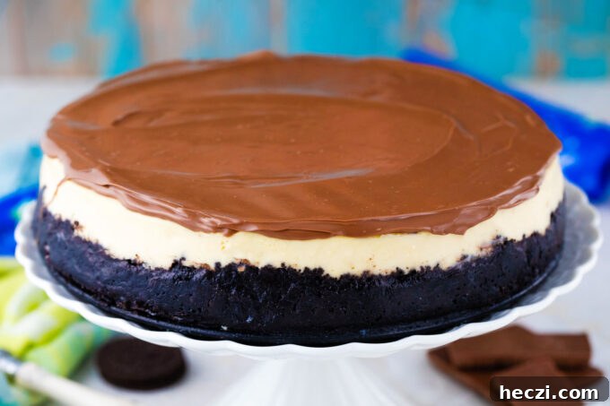 Homemade Bailey's cheesecake topped with chocolate ganache.