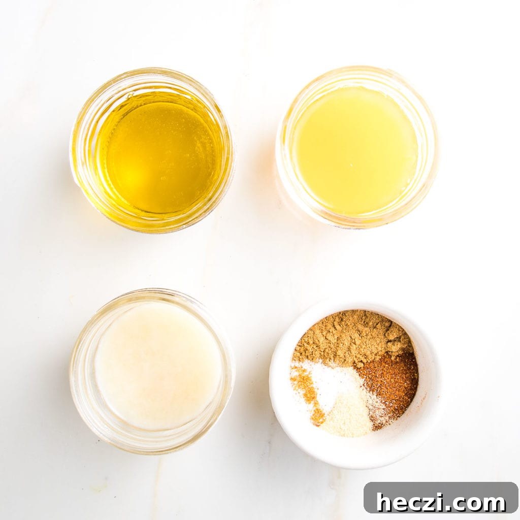 Dressing ingredients in small glass dishes:  olive oil, lime juice, orange juice, assorted dry spices