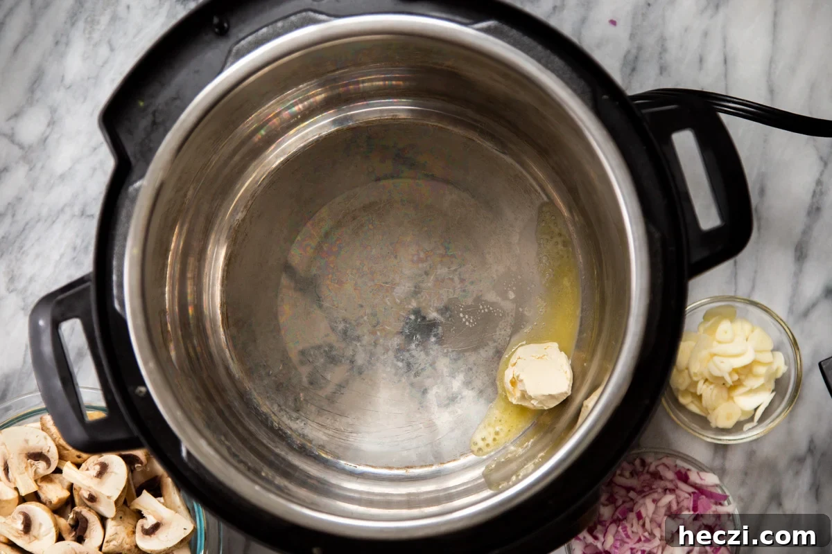 Garlic Mushrooms in the Instant Pot: Tender, Flavorful Side Dish 5 vegan butter being melted in an Instant Pot