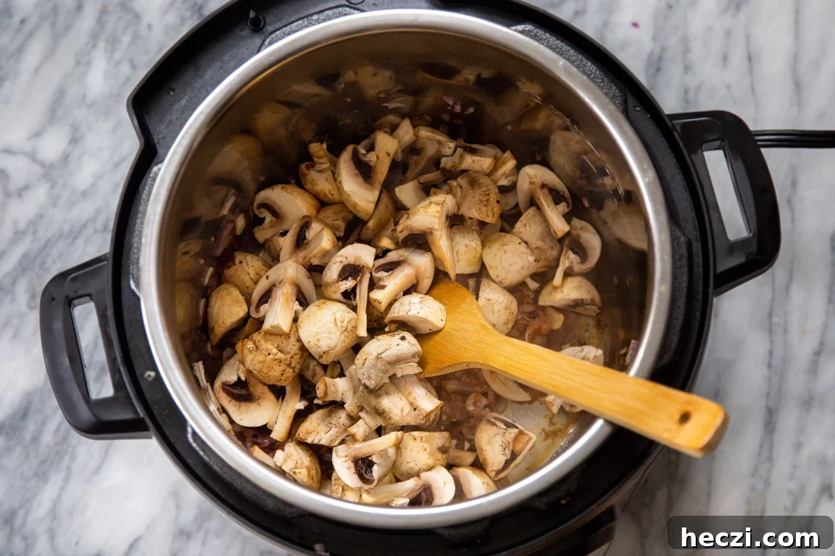 Garlic Mushrooms in the Instant Pot: Tender, Flavorful Side Dish 8 quartered mushrooms in an Instant Pot