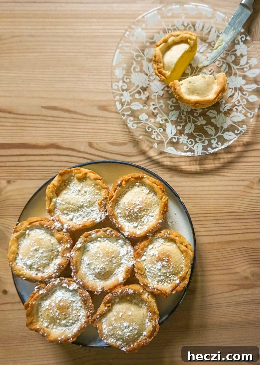Cremelinser Mini Custard Pies Recipe – Norwegian Cream Tarts 2 Mini custard pies on a plate with one cut in half
