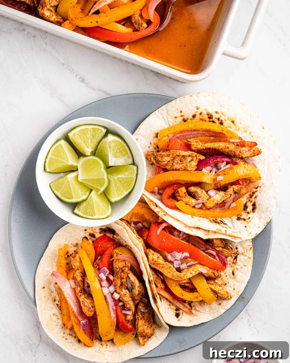 Instant Pot Chicken Fajitas in serving dish and tacos.
