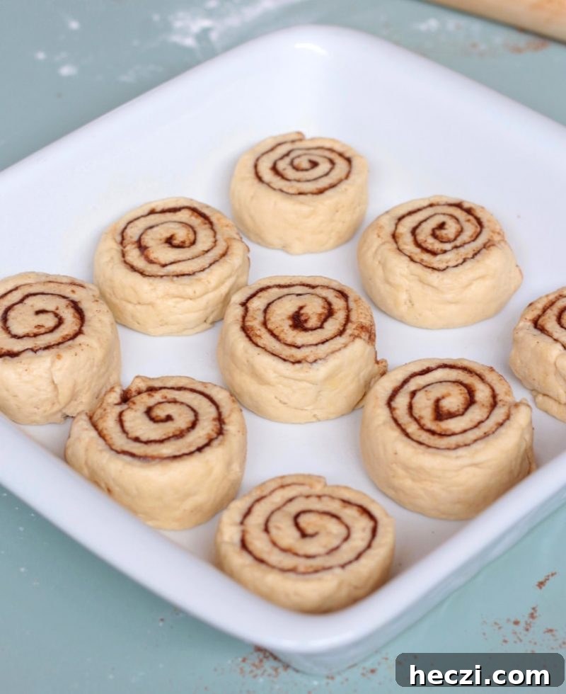 Unbaked rolls in a white ceramic dish