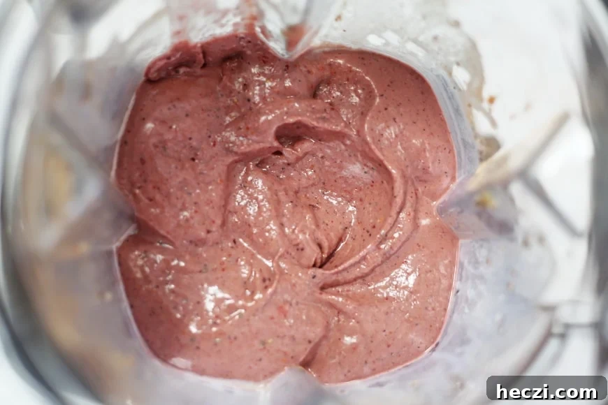 Overhead shot of the superfood berry smoothie bowl in the blender container