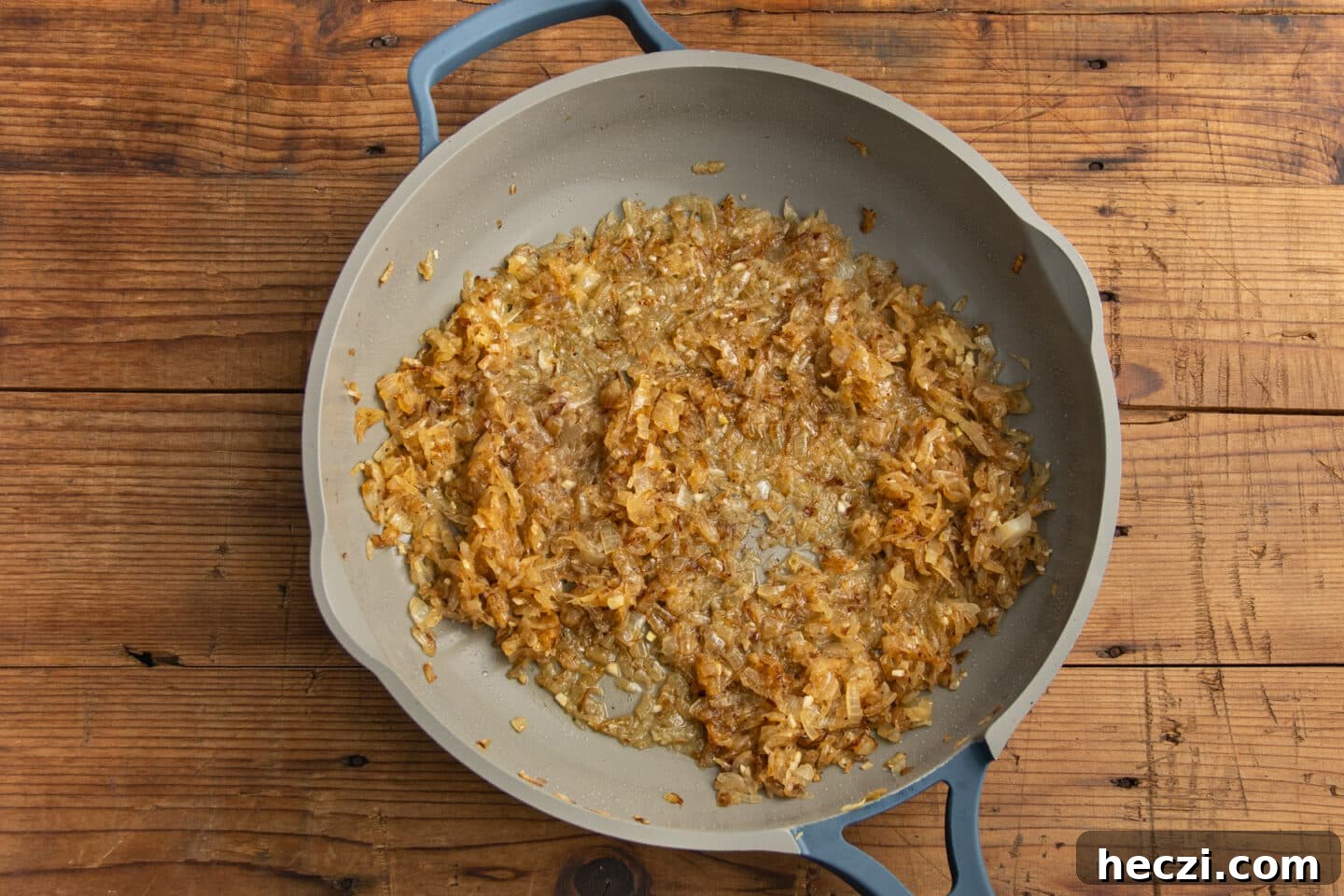 Caramelized Onion Dip with Greek Yogurt — Creamy Savory Recipe 9 This is a picture of the skillet with the onions cooking with water added to deglaze the pan.