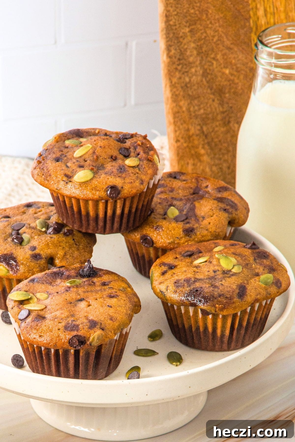 A plate full of pumpkin chocolate chip muffins (gluten-free).