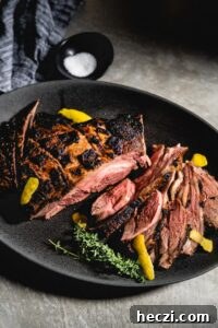 grilled leg of lamb on serving platter head on