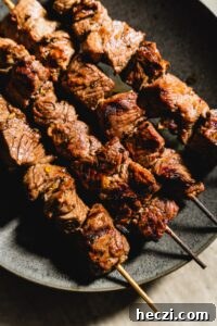 lamb kabobs on a plate side view