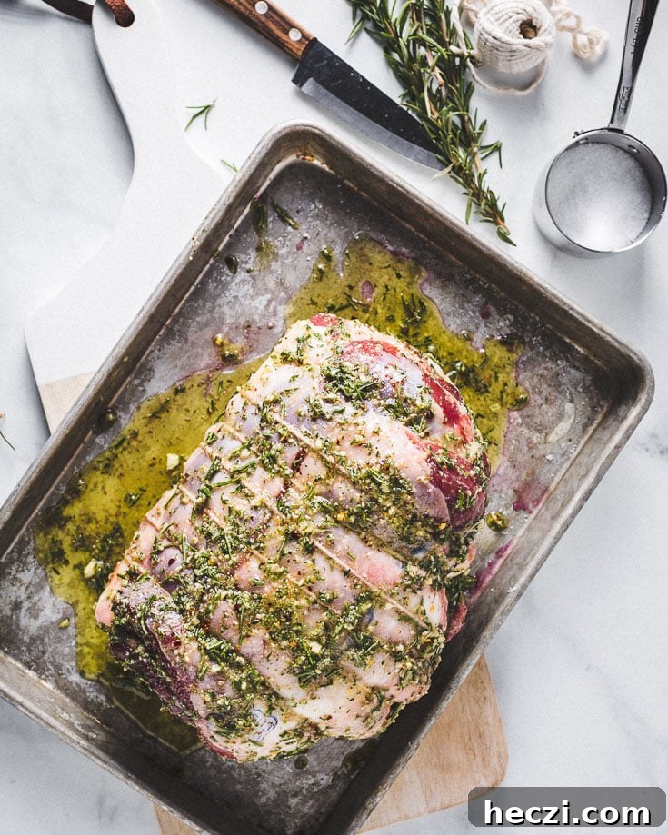 sous vide leg of lamb marinating on sheet pan overhead