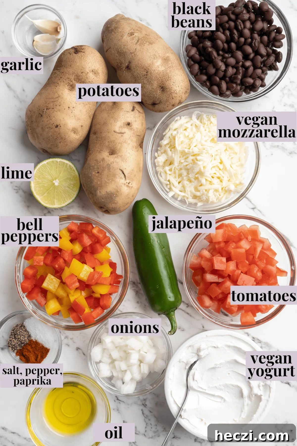 These crispy loaded potato skins are filled with veggies, black beans, vegan cheese, and sour cream. A vegan appetizer that doubles as a meal! Overhead view of ingredients for loaded potato skins with labels