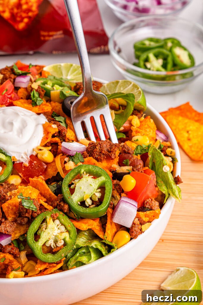 fork in bowl of Doritos taco salad