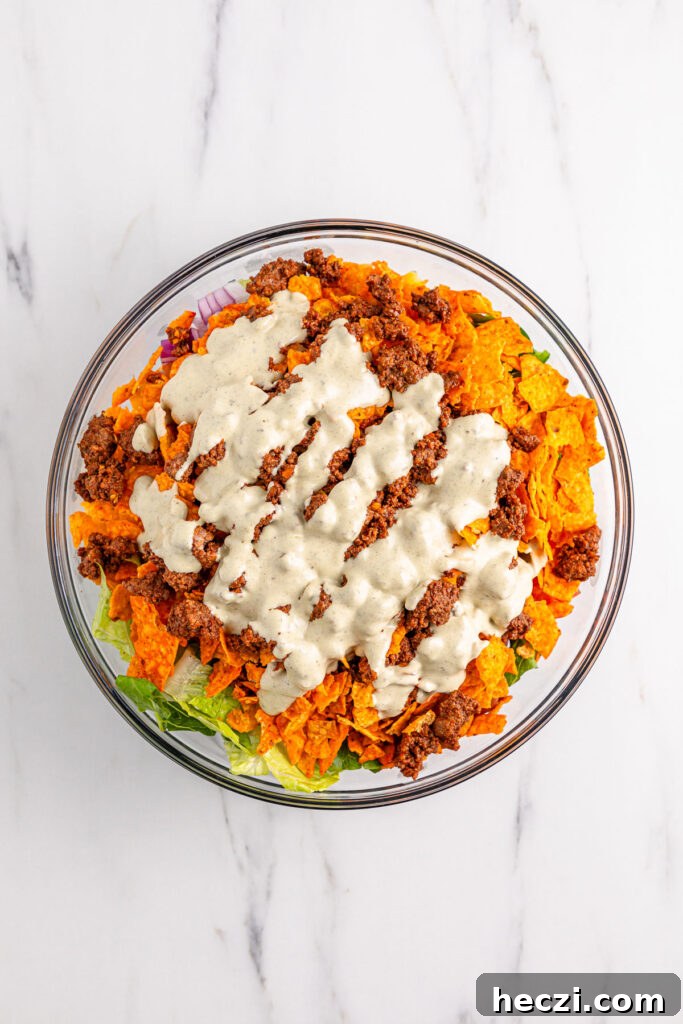 Doritos taco salad with dressing on top