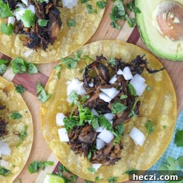 overhead shot of crispy pork carnitas on cutting board