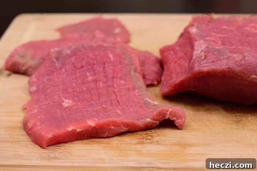 Lean Eye of Round Roast Sliced Thin and Ready to Marinate