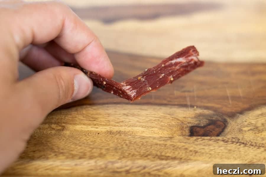 Testing jerky by bending it to see if its finished