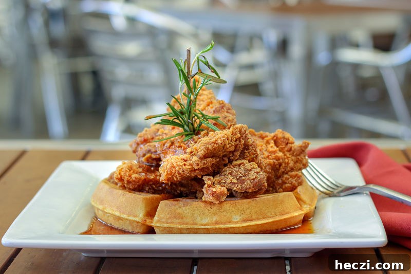Fixture Kitchen & Social Lounge: Full Review and Insider Tips 8 chicken and waffles with rosemary and chipotle maple syrup at Fixture Fort Worth