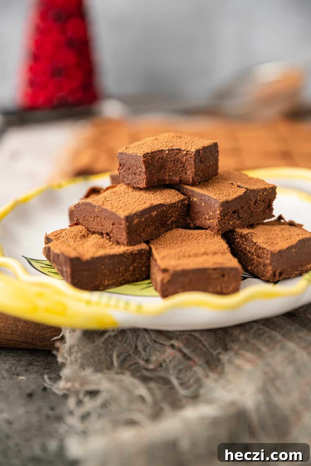 stacked chocolate squares dusted with cocoa