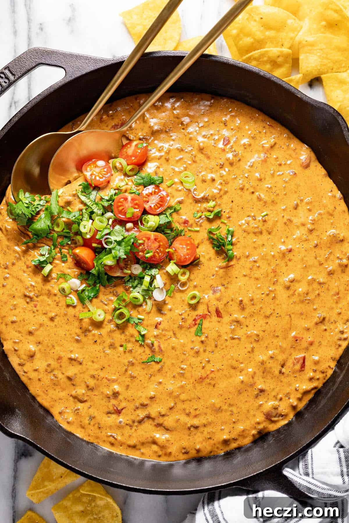 Creamy Rotel Dip Recipe with Cheesy Sausage for Parties 2 Big cast iron pan filled with homemade cheesy Rotel dip.