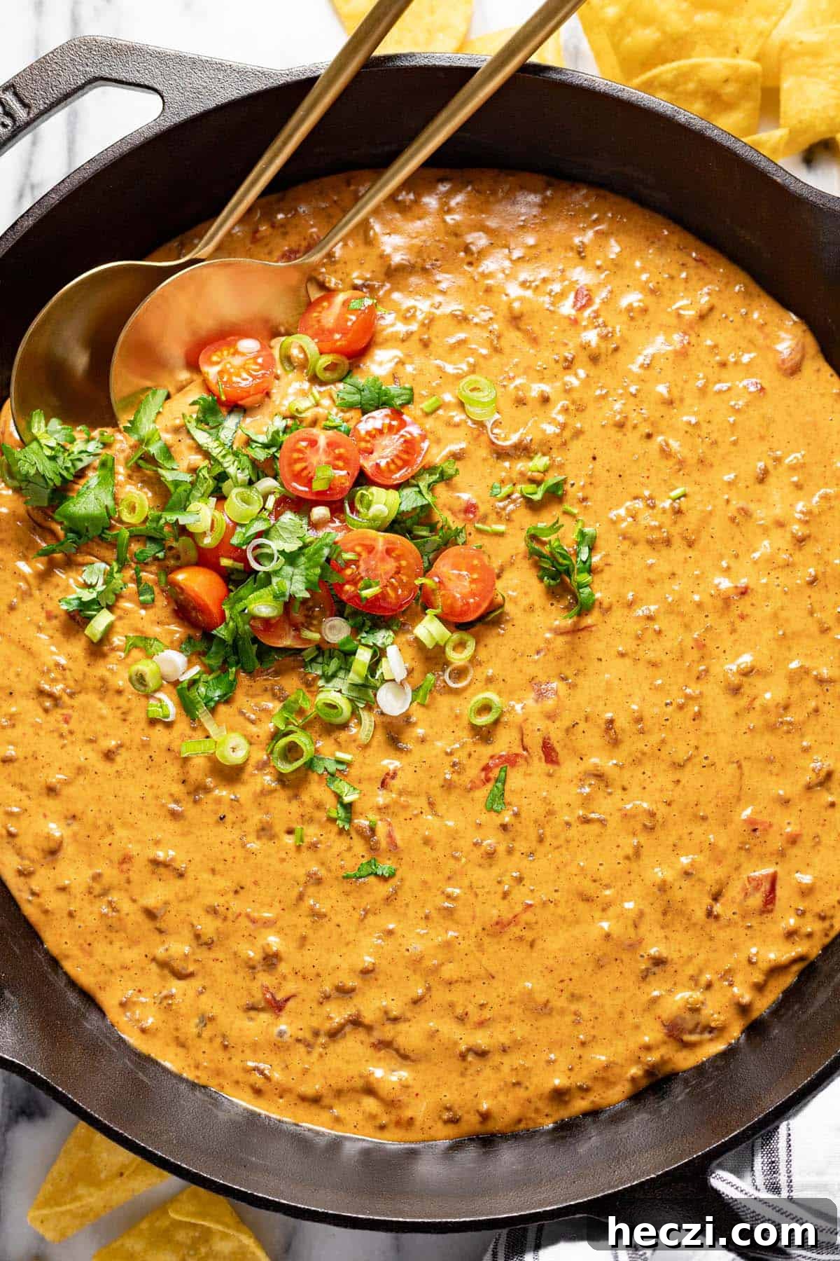 Creamy Rotel Dip Recipe with Cheesy Sausage for Parties 7 Big cast iron pan filled with homemade cheesy Rotel dip.