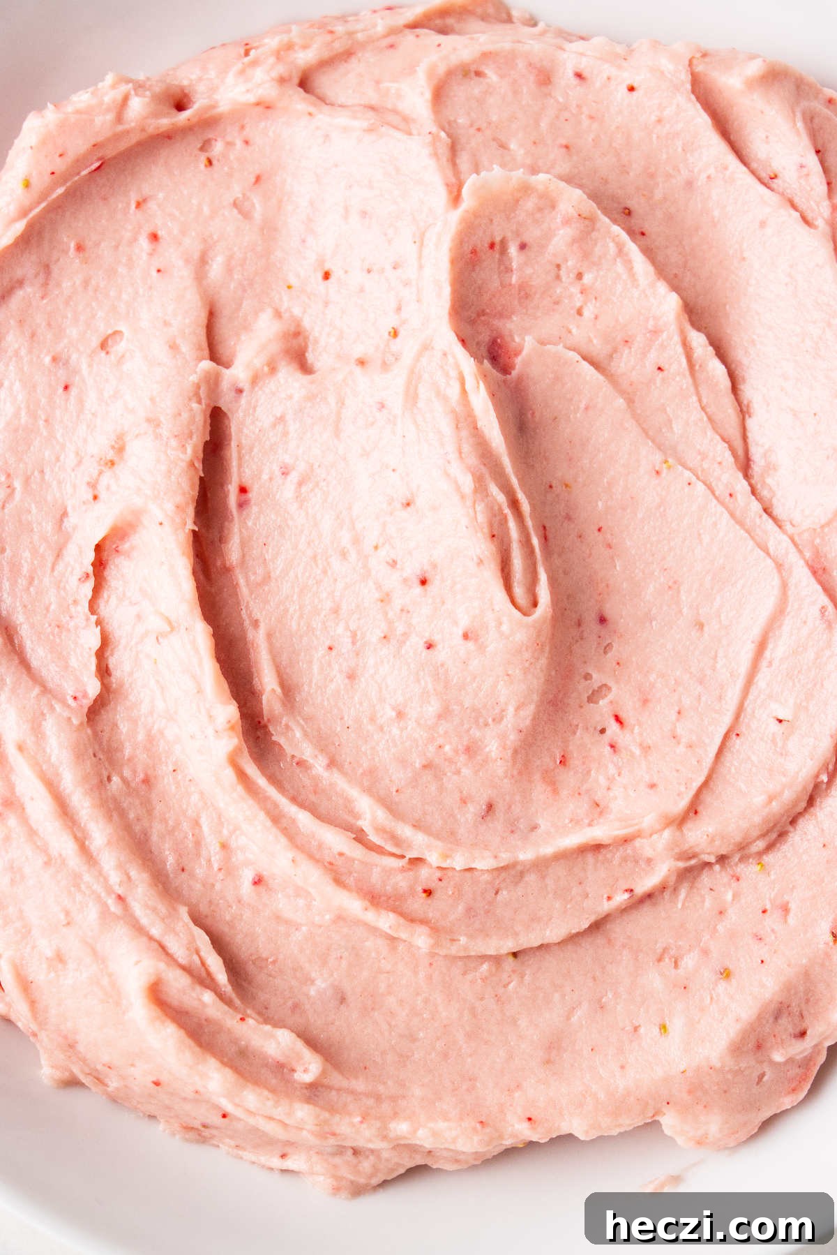 Strawberry Cream Cheese Frosting Recipe for Cakes & Cupcakes 11 Strawberry frosting in a bowl.