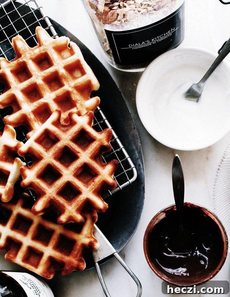 Classic Homemade Belgian Waffles Recipe for Crispy, Fluffy Results 7 Waffles with Nutella, yogurt, and granola on the side