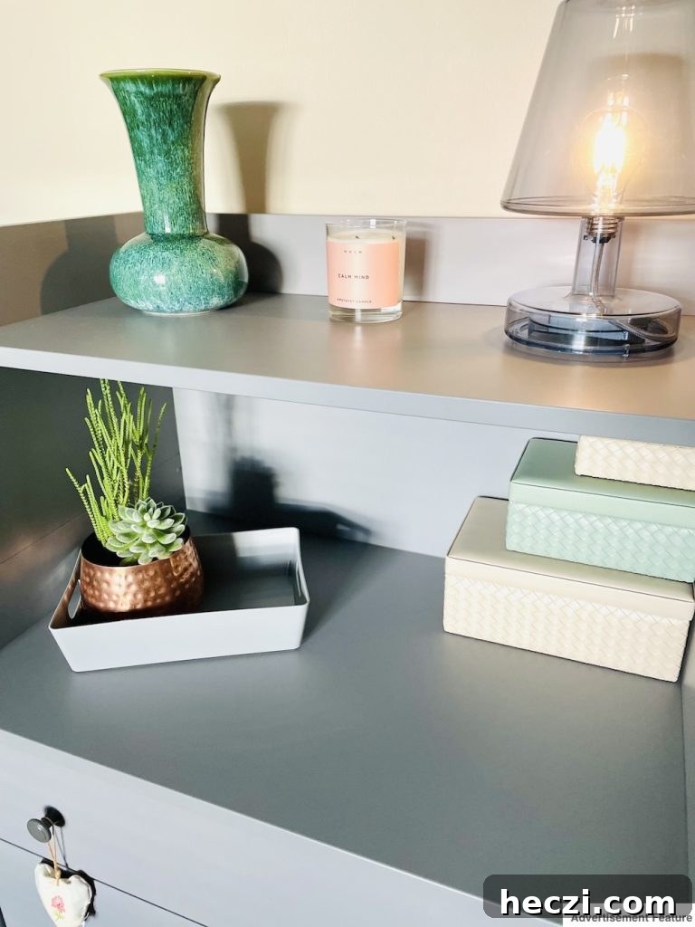 cupboard with nesting storage boxes and a storage tray with a plant