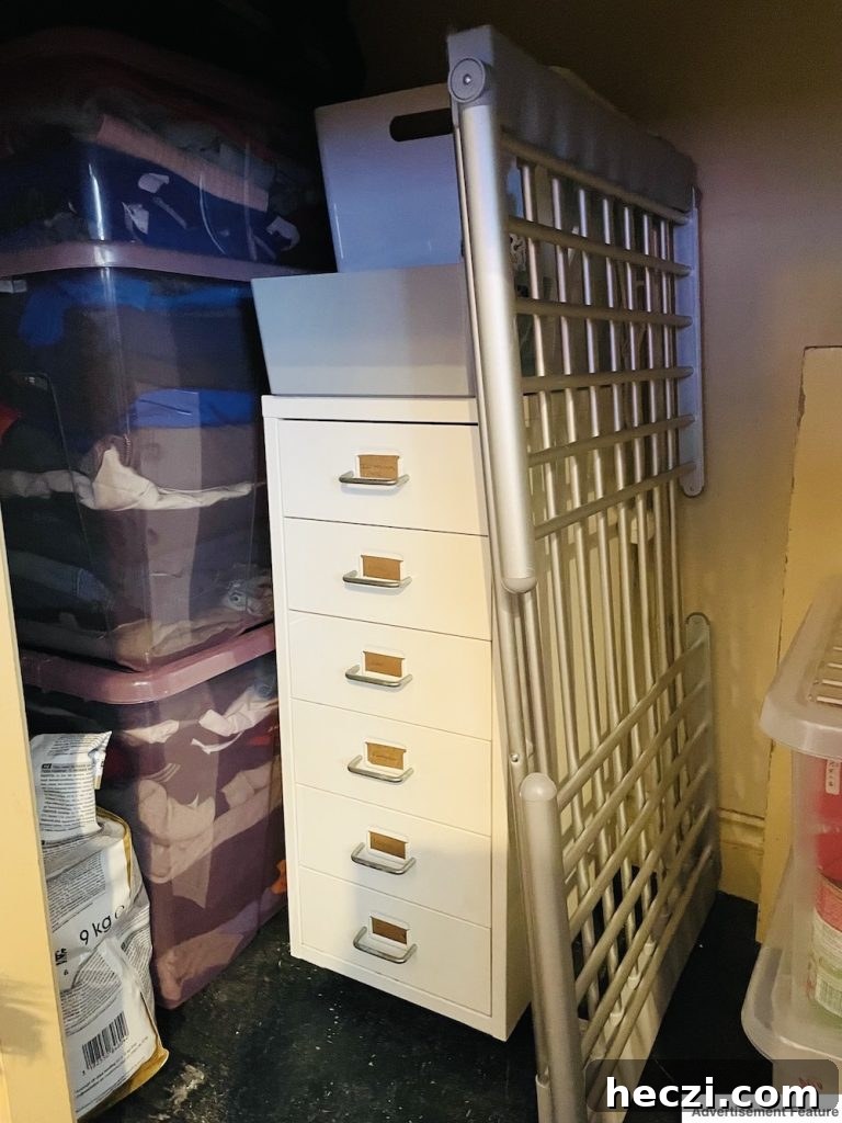 tidy under-stair cupboard using storage crates and boxes