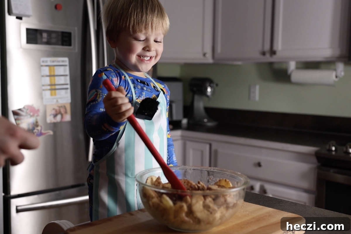 Chewy Apple Crisp Bars with Cinnamon Streusel 8 Mixing apples with spices.