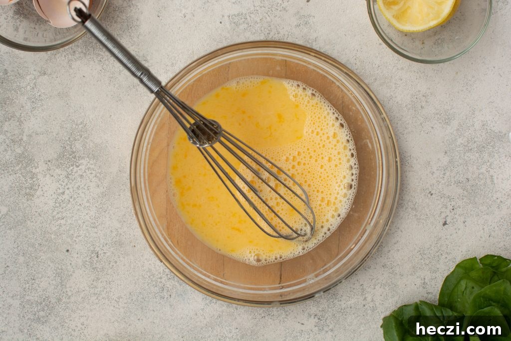 two beaten eggs with a whisk for tempering into soup