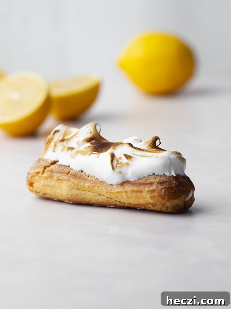 Gluten Free Lemon Meringue Éclairs filled with lemon mousse and topped with toasted meringue