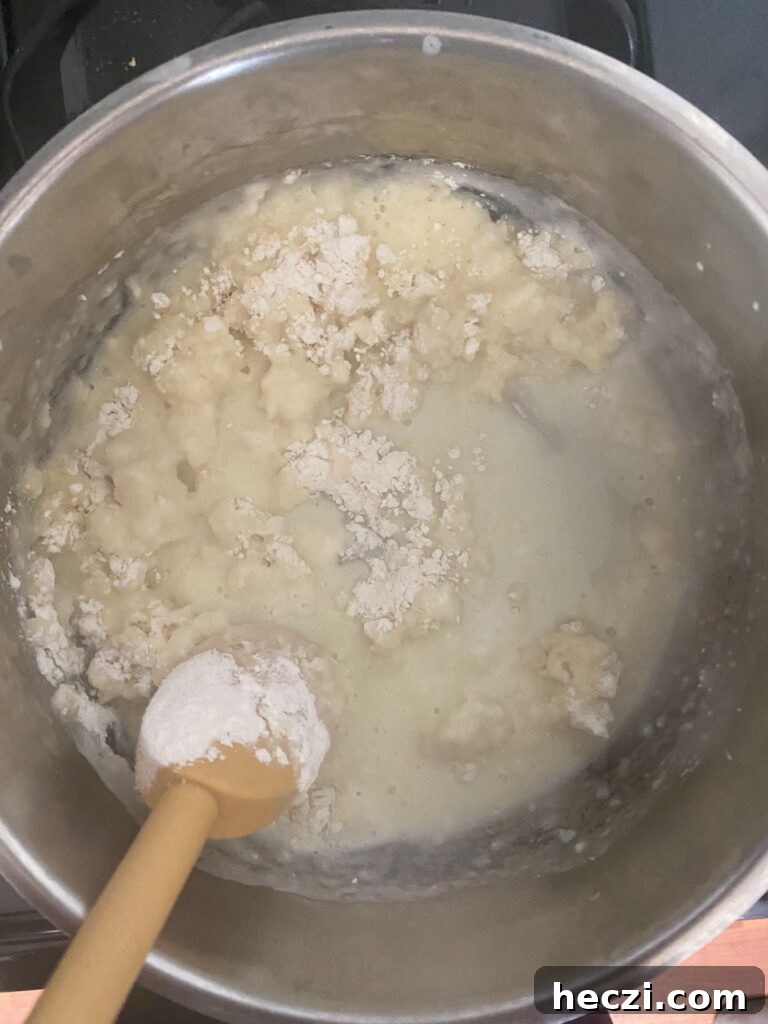 Add all the flour at once to the boiling liquid