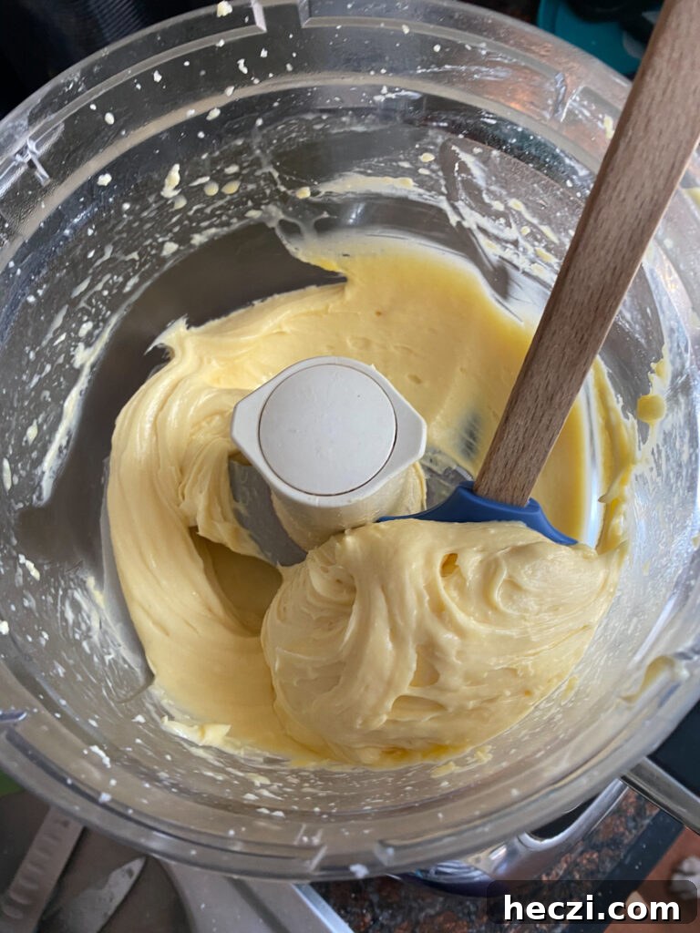When all your eggs are added, continue to blend for 3 minutes. Your batter will have a smooth and glossy look