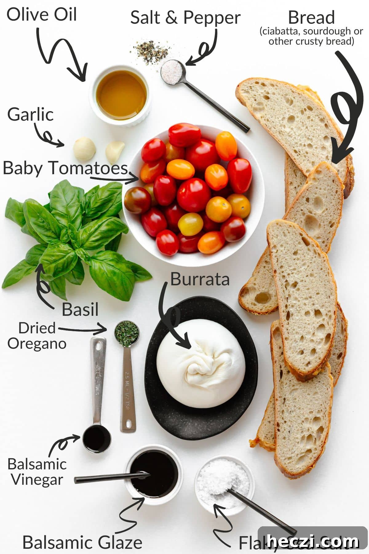 Labelled photo of ingredients needed to make burrata and tomato bruschetta.