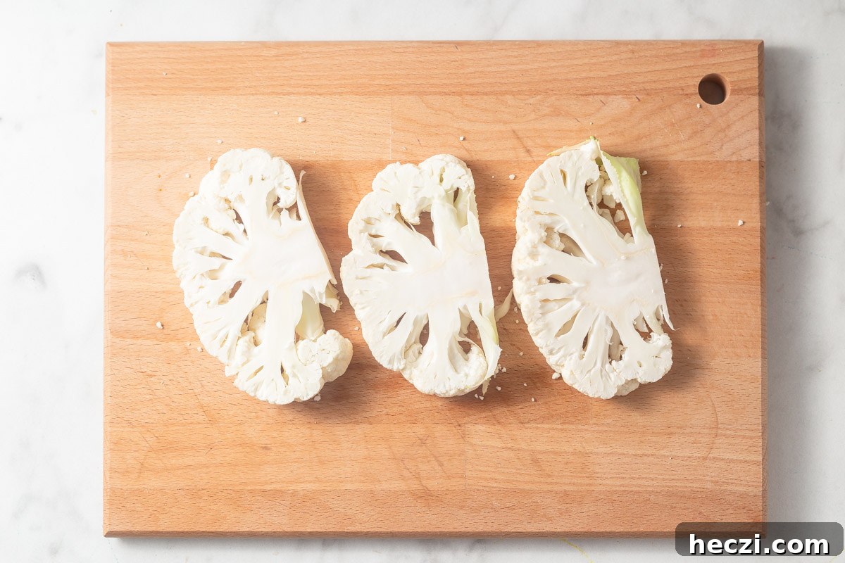 cauliflower steaks on the cutting board.