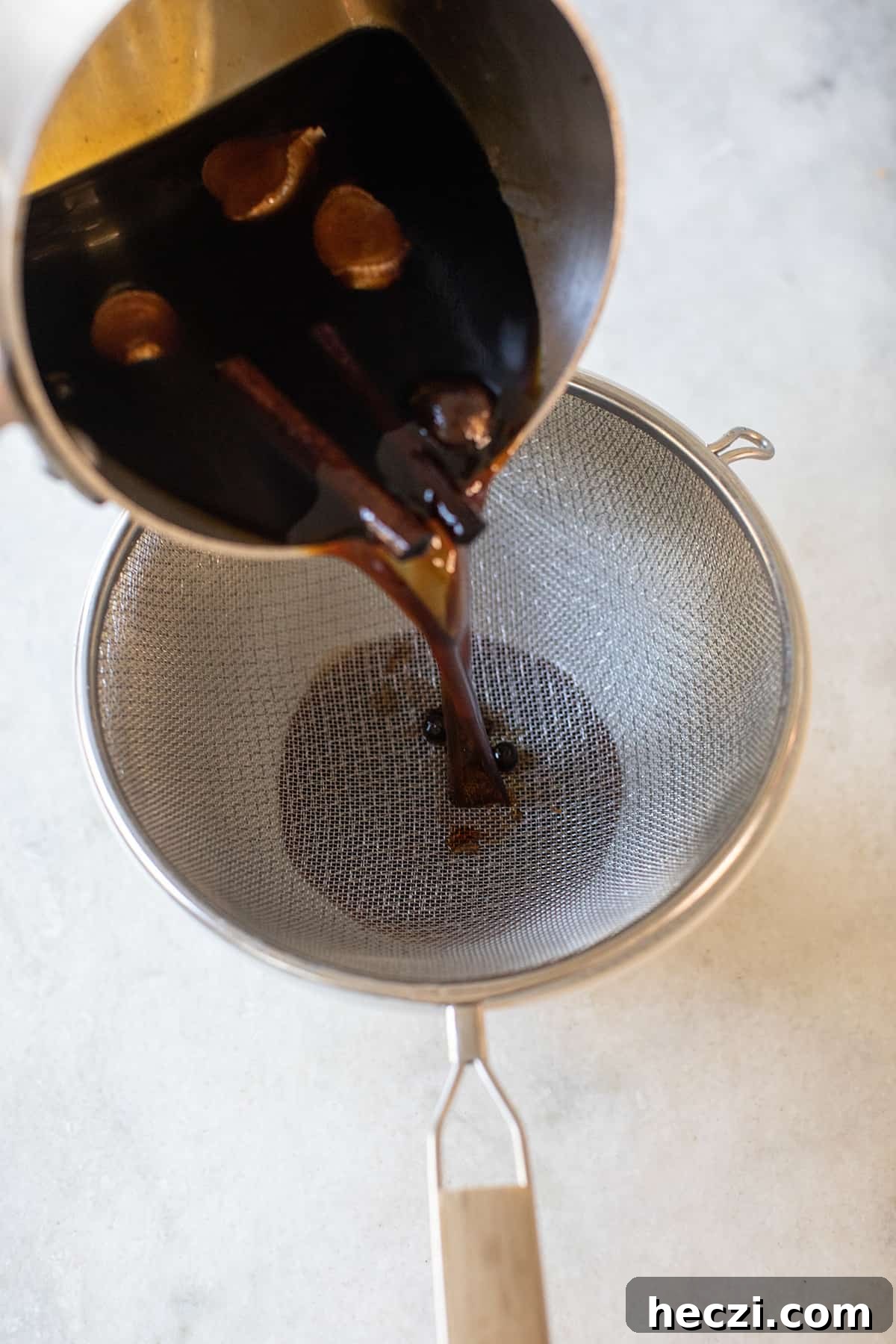 Homemade Gingerbread Syrup Recipe for Coffee & Cocktails 4 straining gingerbread syrup