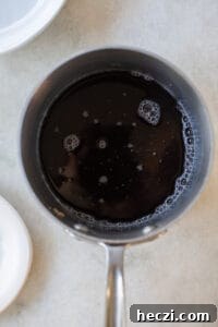 Homemade Gingerbread Syrup Recipe for Coffee & Cocktails 9 water and brown sugar in a saucepan