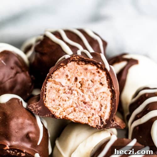 Raspberry truffle cut in half.