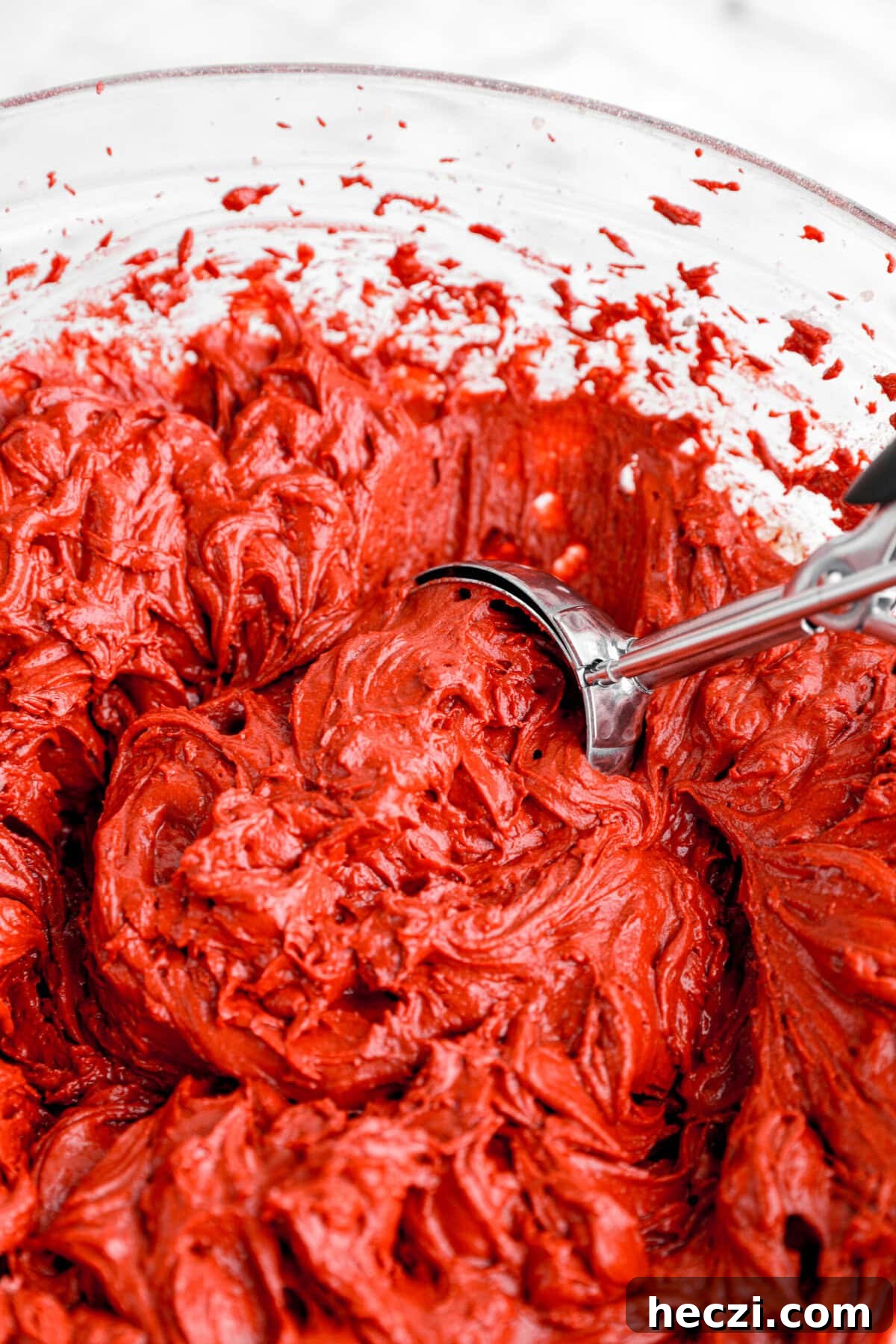 Red Velvet Molten Lava Cupcakes: Gooey Chocolate Center Delight 7 cookie scoop in red velvet cake batter.