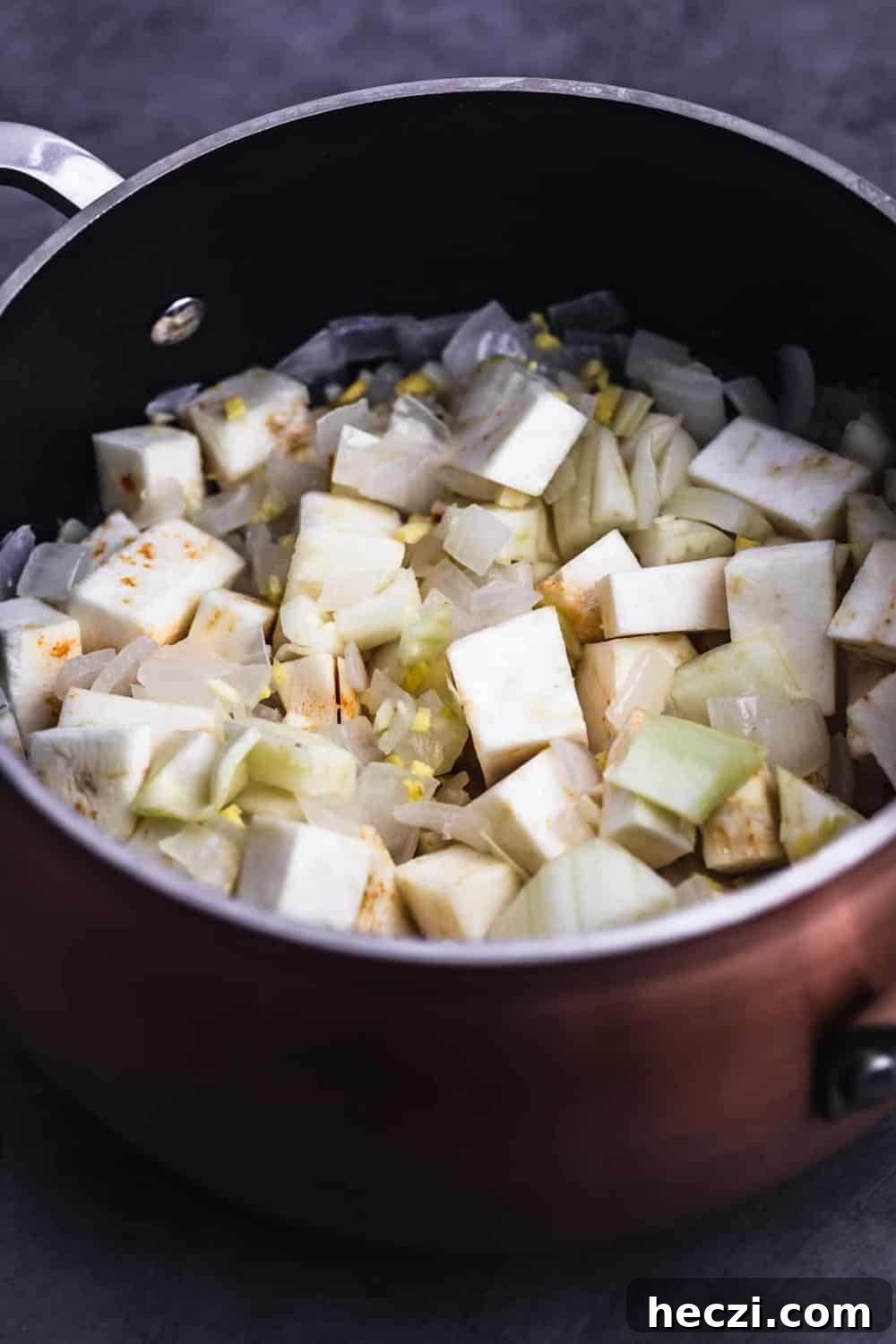 In process shot with celery root, fennel, ginger and garlic added to put with sautéed onions.
