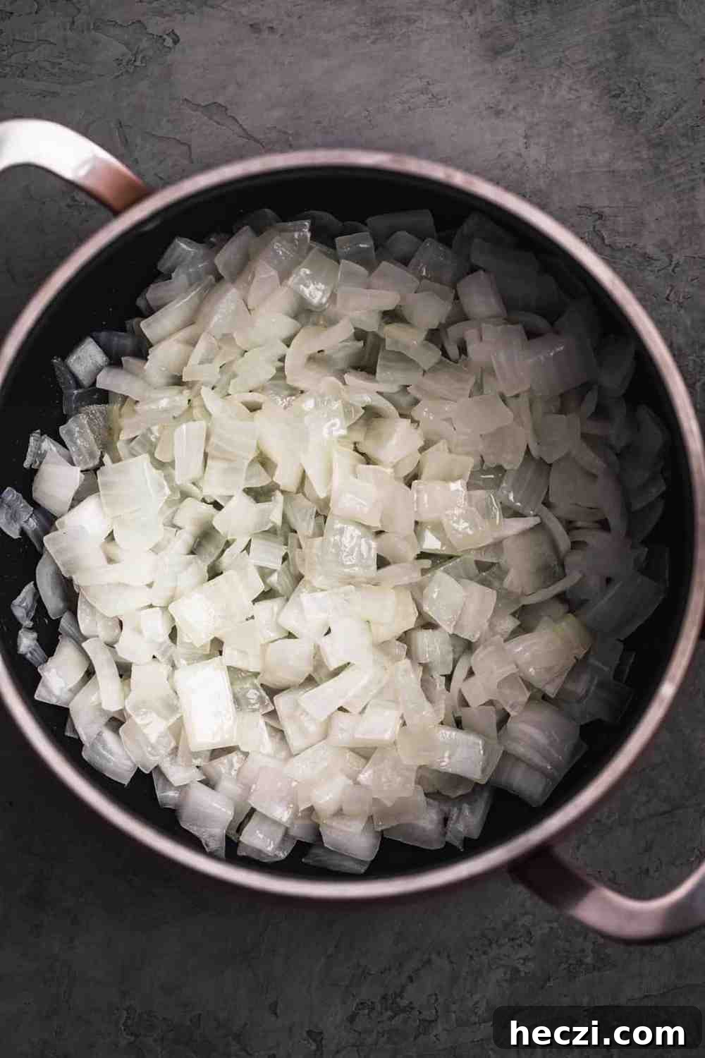 Sautéed onions in a pot.