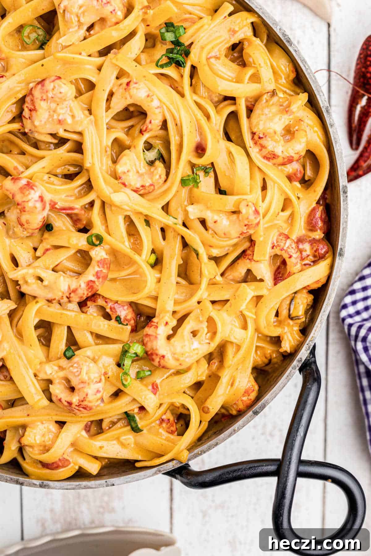 Creamy Crawfish Fettuccine with Garlic and Parmesan 2 close up of a skillet of crawfish fettuccine