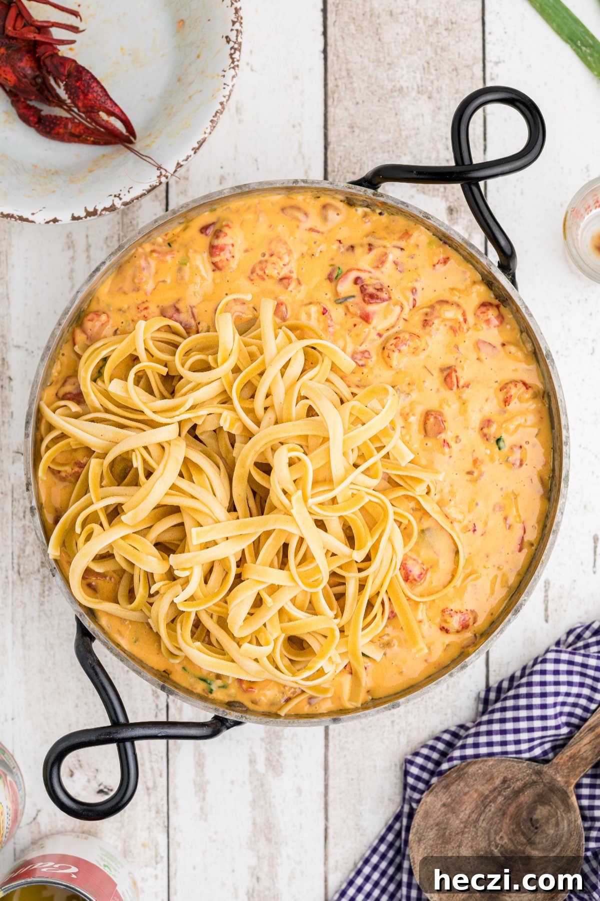 Creamy Crawfish Fettuccine with Garlic and Parmesan 11 Cooked fettuccine added to a crawfish cheese sauce.