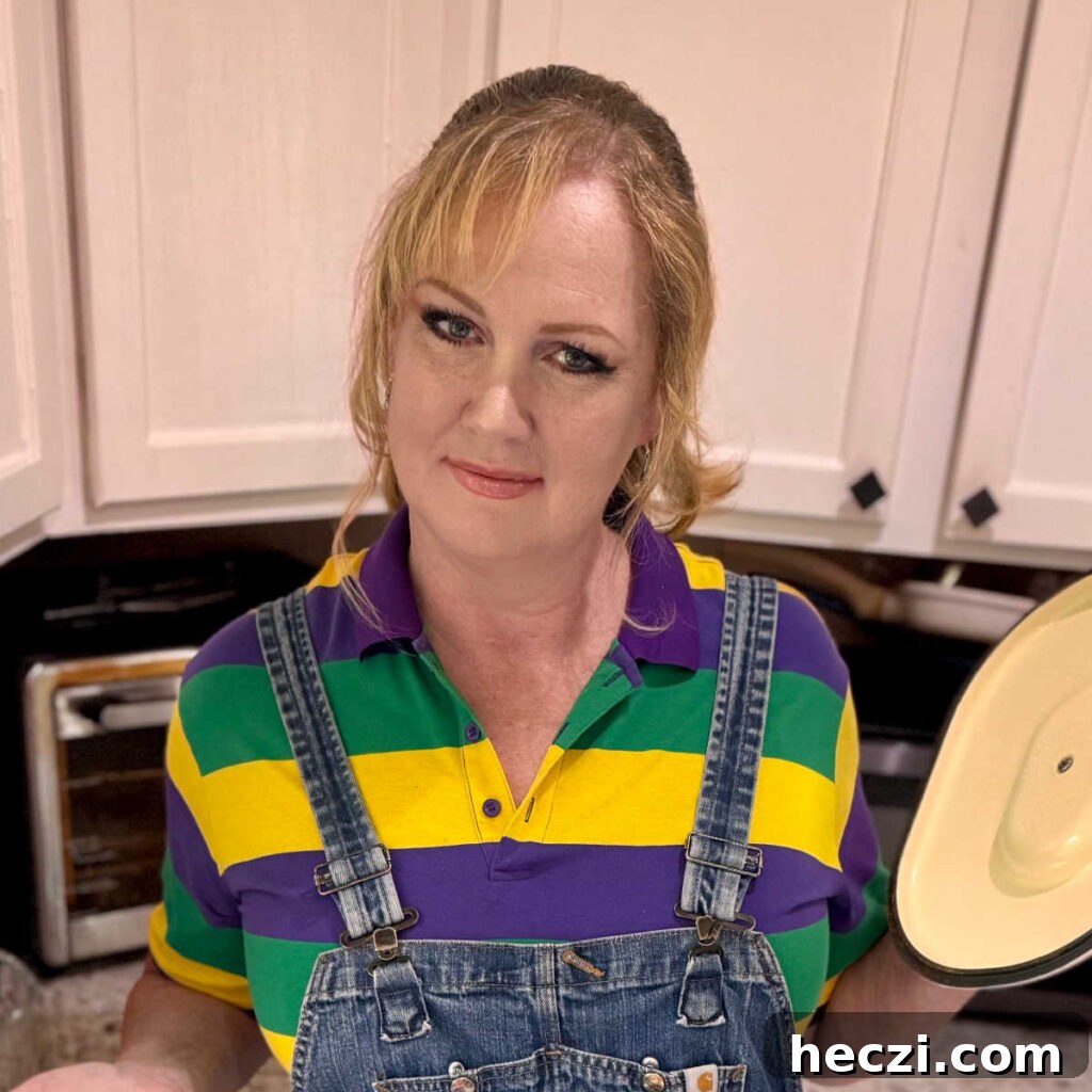 Creamy Crawfish Fettuccine with Garlic and Parmesan 13 A picture of Melanie Cagle showing something in a cooking pot.
