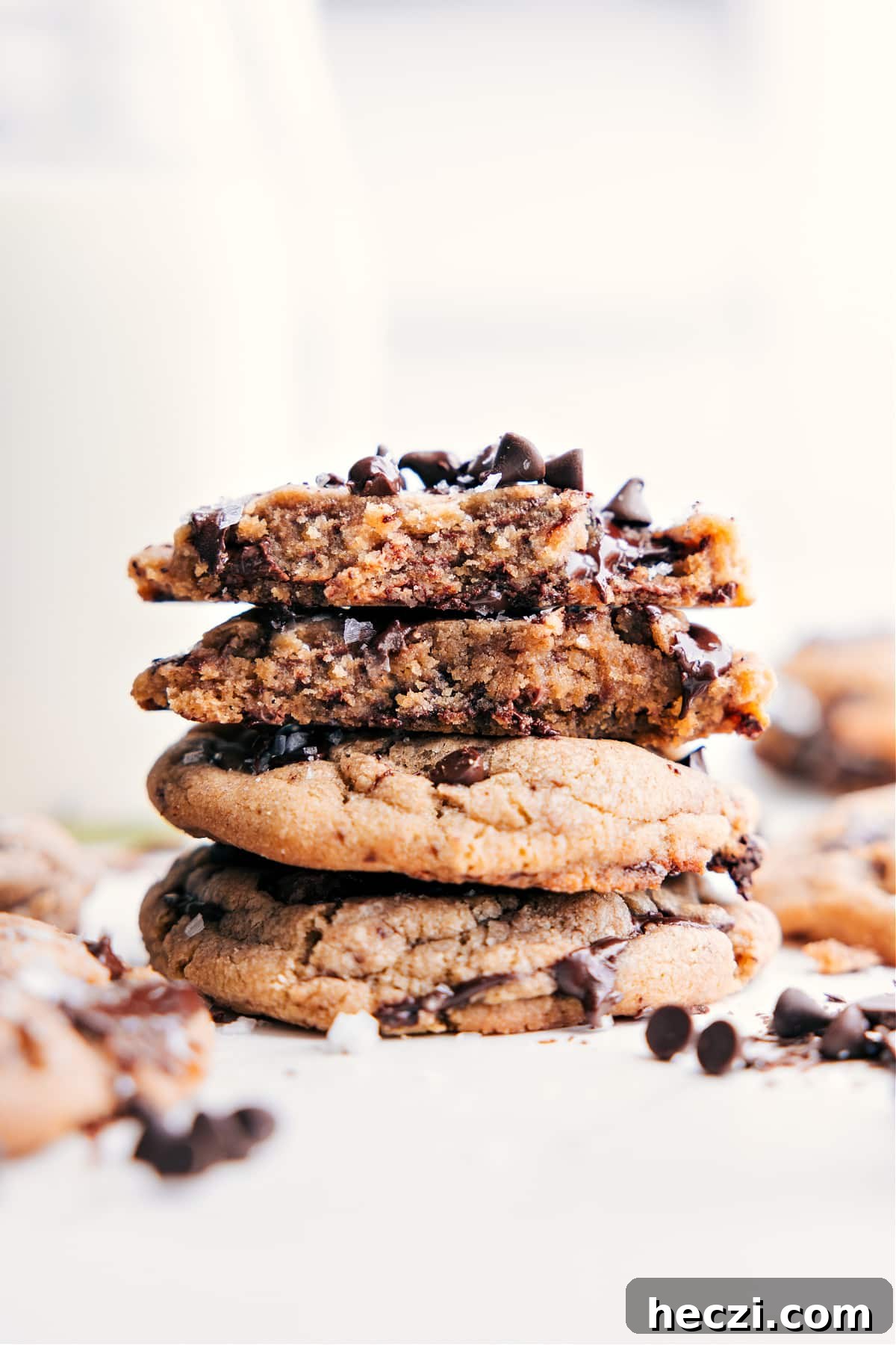 Small Batch Chocolate Chip Cookies stacked, with one broken open to show the soft, gooey center.