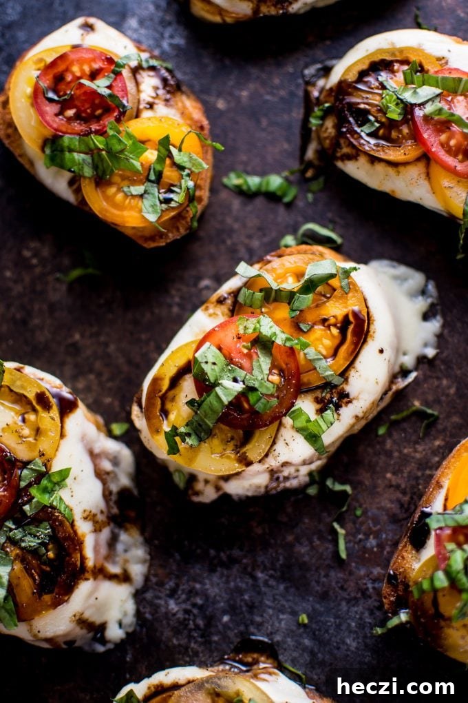 Caprese Crostini Recipe: Fresh Tomato, Basil & Mozzarella Bites 2 close-up of garlic Caprese crostini melts