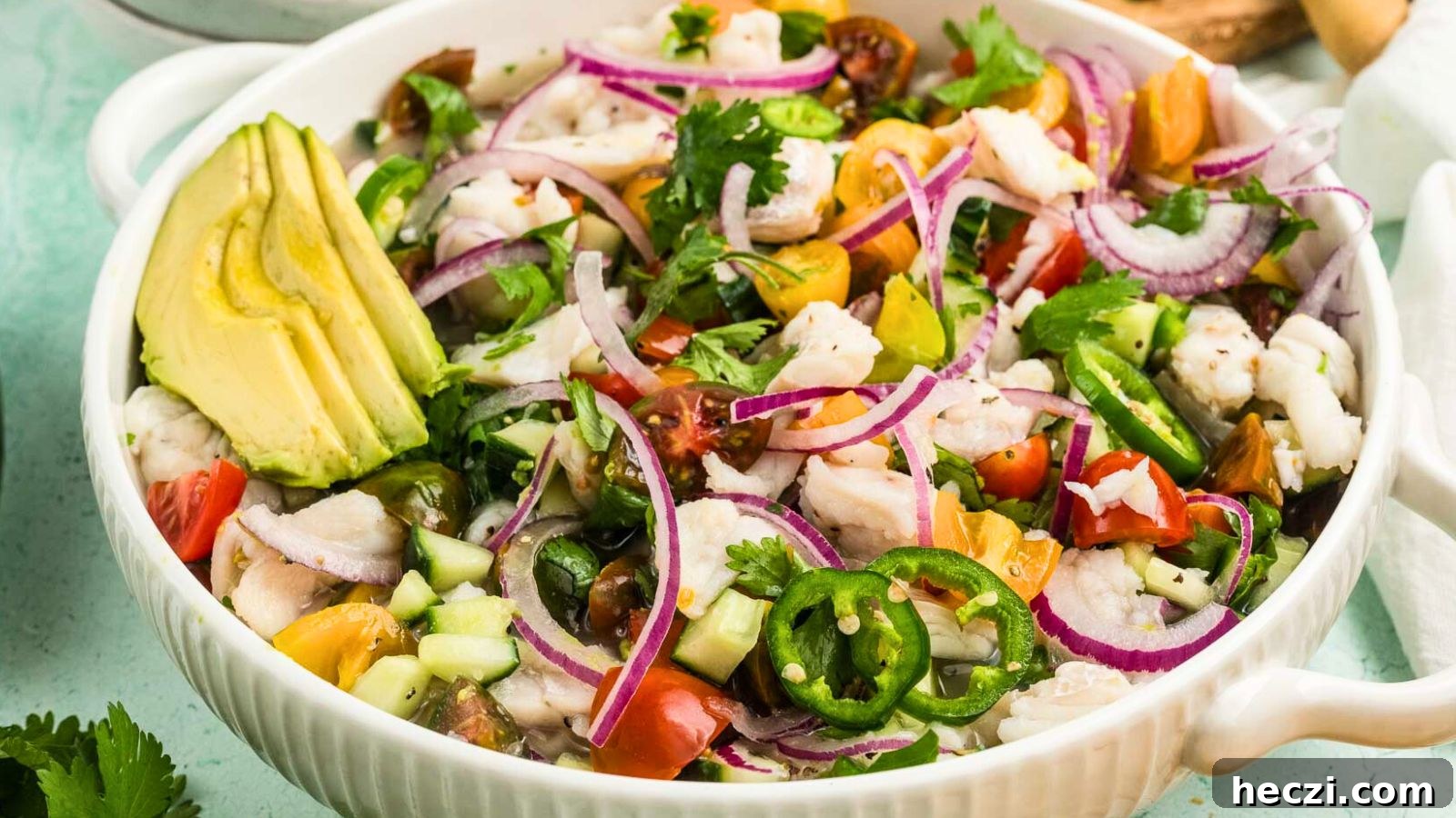 Fresh fish ceviche with bright citrus, peppers, and herbs served chilled in a bowl.