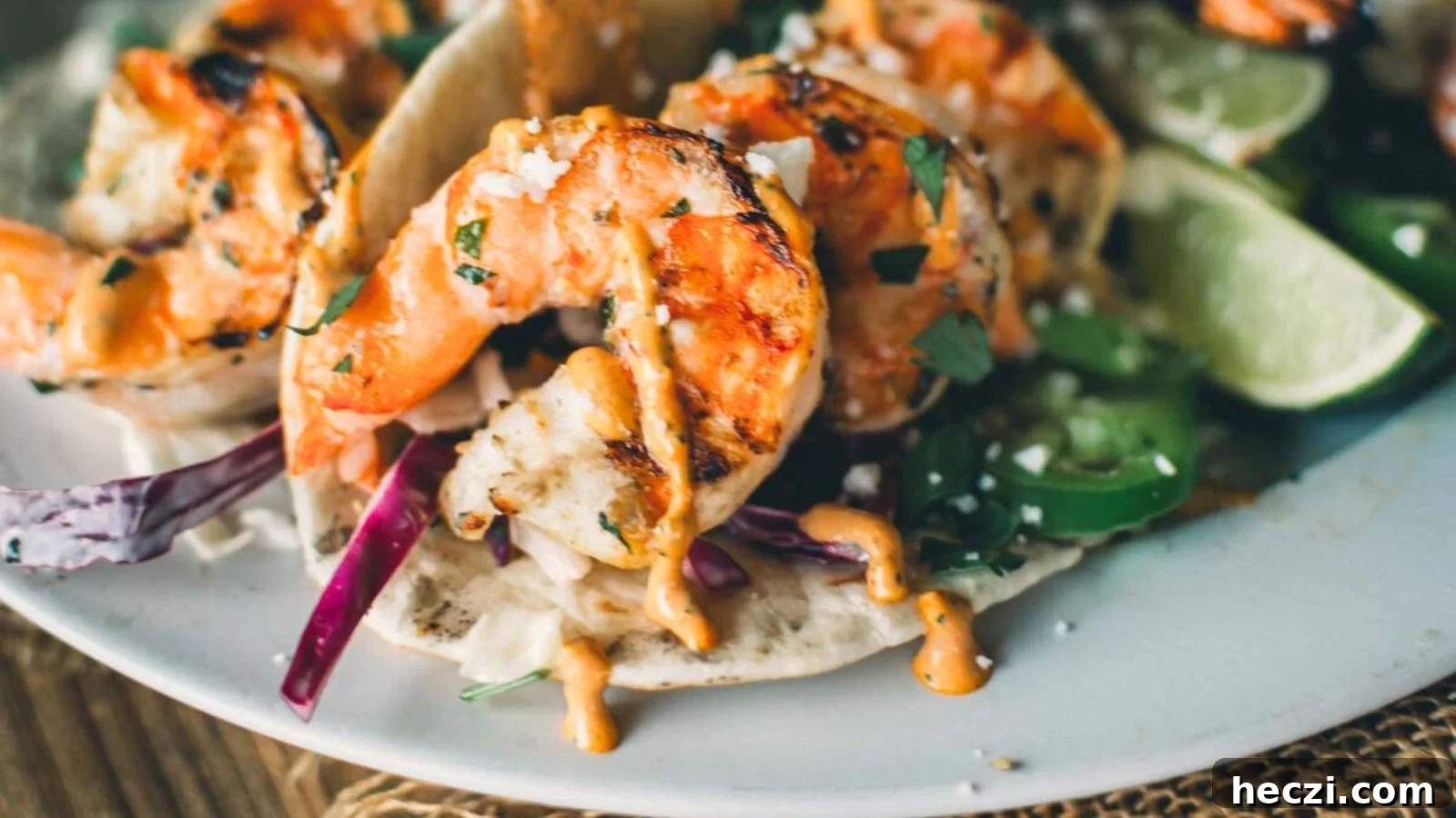 Grilled shrimp tacos with seasoned shrimp, slaw, and lime tucked into warm tortillas.