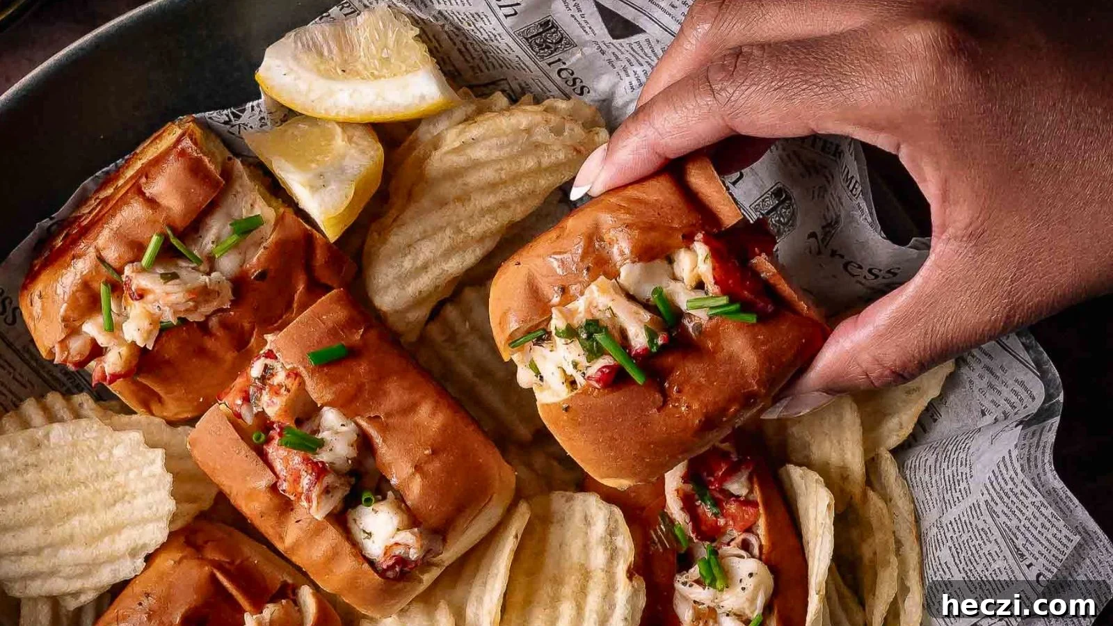 Mini lobster rolls packed with warm lobster in tarragon butter on toasted split-top buns.
