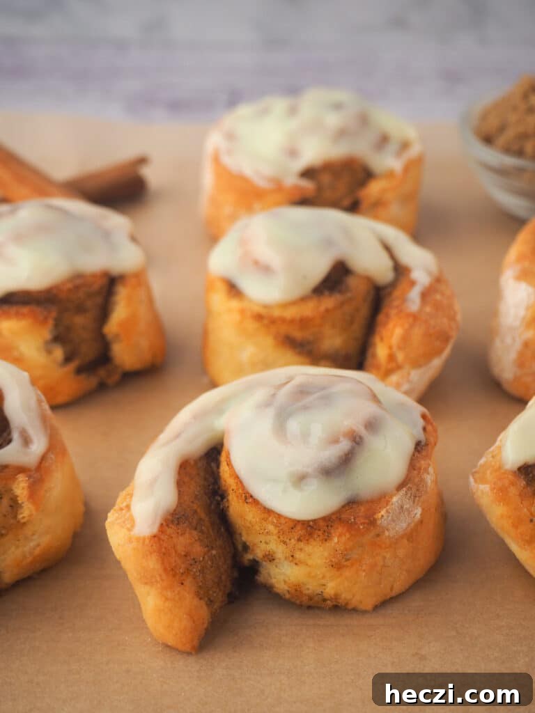 Air Fryer Cinnamon Rolls: Quick, Fluffy Homemade Recipe 21 Rolls on baking paper.